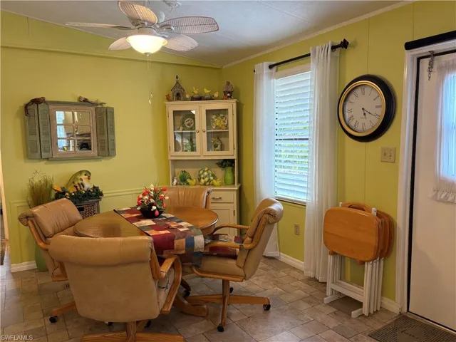 Dining space featuring crown molding and ceiling fan