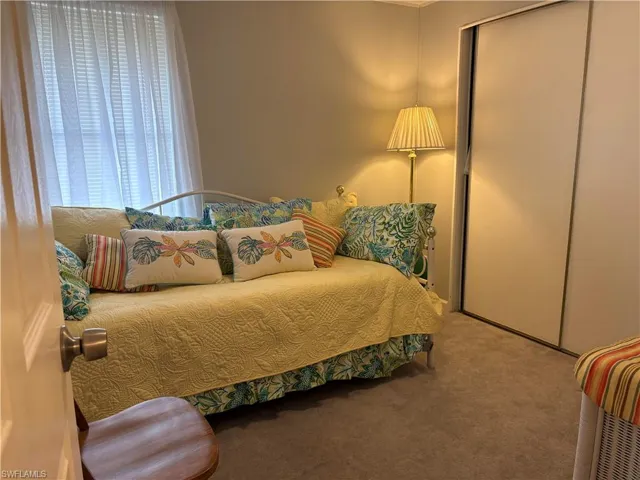 Bedroom featuring a closet and carpet flooring