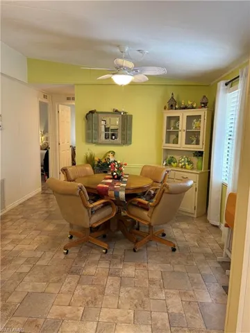 Dining room with breakfast area and ceiling fan