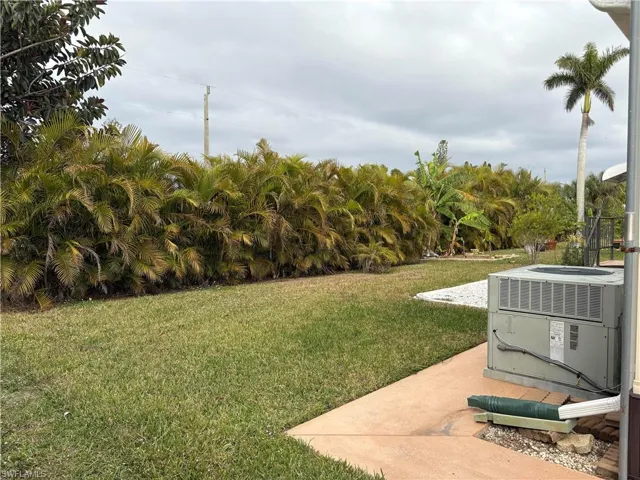 View of yard with cooling unit