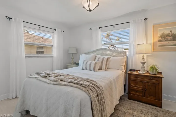 Bedroom featuring baseboards and light wood finished floors