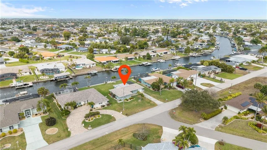 Aerial overview of property's location featuring nearby suburban area and a nearby body of water