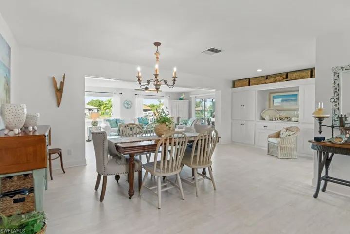 Dining room featuring hanging lights and baseboards