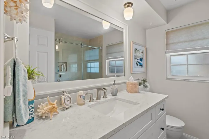 Bathroom with vanity and a shower stall