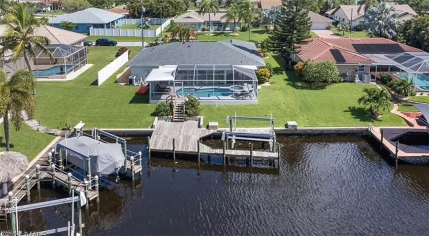 Bird's eye view featuring a water view and a residential view