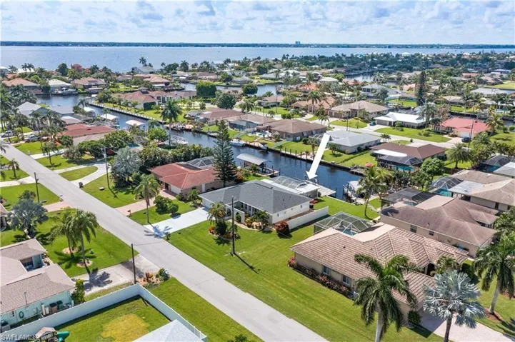 Bird's eye view with a water view and a residential view