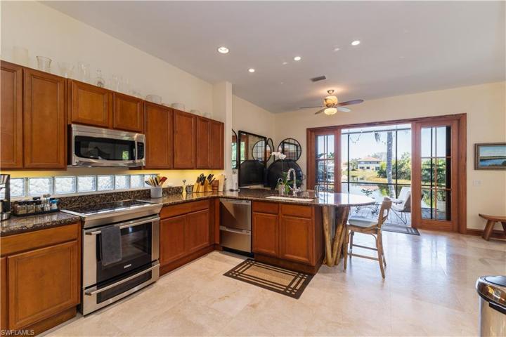 Custom cabinetry in pecky cypress, soft close doors, drawersConvection microwave, vented to exterior
