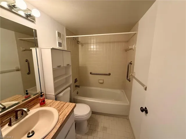 Full bathroom featuring vanity and shower / tub combination