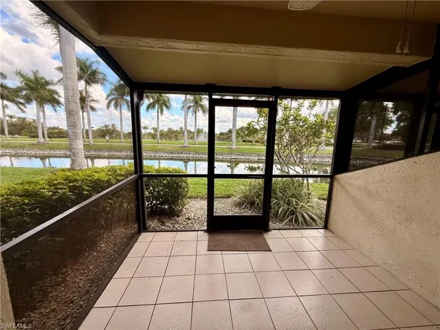 Screened lanai with a water view