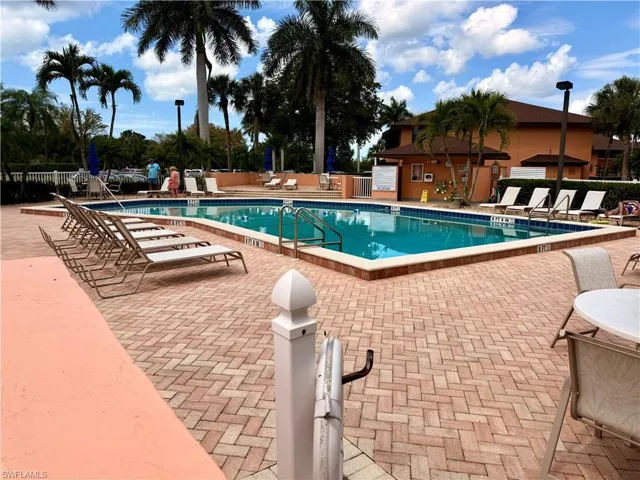 Community pool featuring a patio area