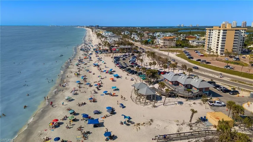 Drone / aerial view featuring a view of the beach and a water view