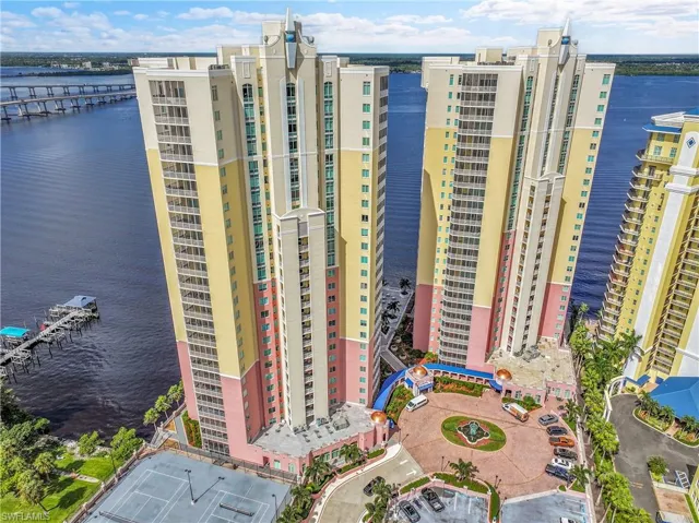 View of apartment building / complex with a water view