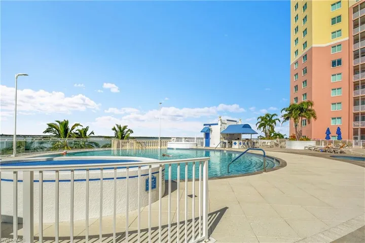 Community pool with a patio