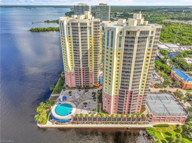 Aerial view of apartment complex and a nearby body of water