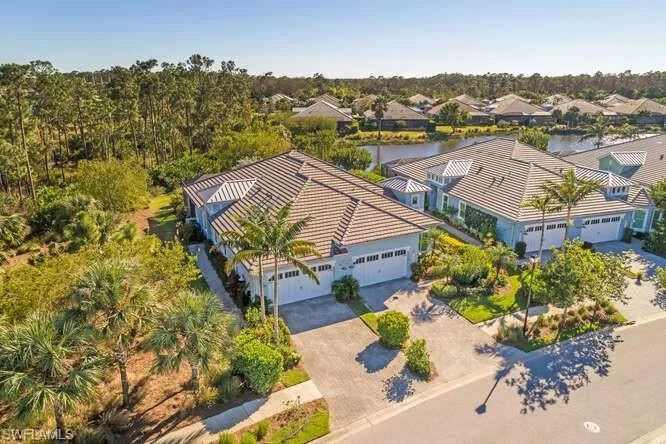 Drone / aerial view of the lot location, and lake behind the house.