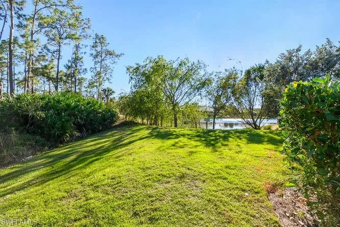 View of green lawn with a water view