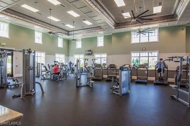 Huge Exercise room featuring free weights, and numerous machines.