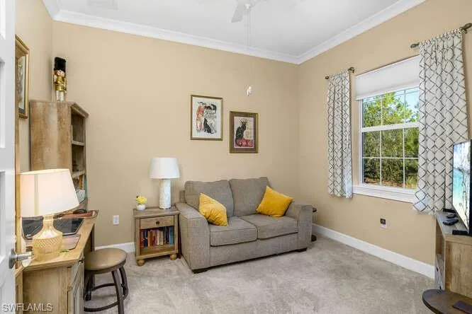 Office / Den with a window facing the treed lot, french doors. Many use this as an extra bedroom for visiting guests.