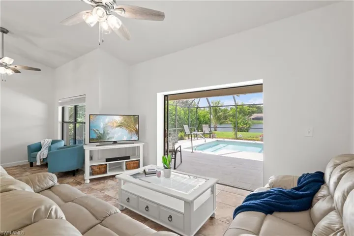 Living room with sliders that open to the pool