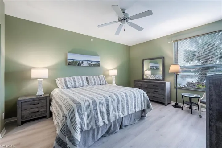 Bedroom featuring ceiling fan and light hardwood / wood-style flooring