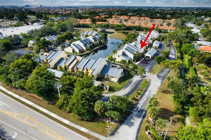 Aerial view of residential area featuring a large body of water