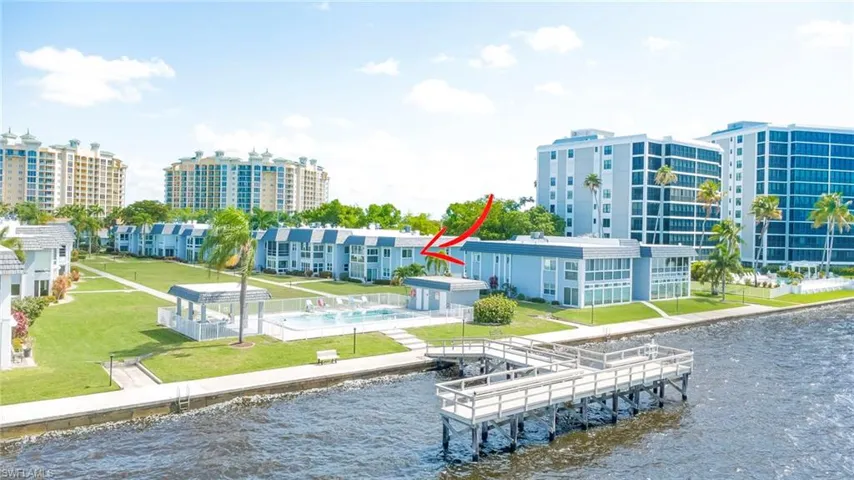 This exemplifies Florida Living at its best!  View of the Fishing Pier, Community Pool and Cabana!