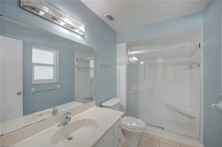 Owner's Bath with an updated Shower Enclosure and Lighting!  Tile Flooring!