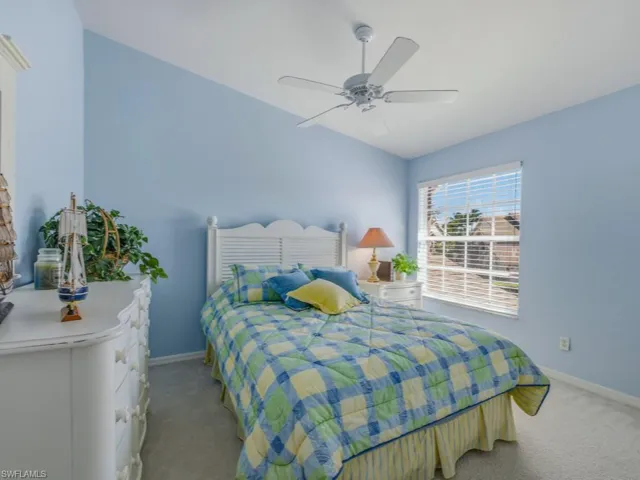 Bedroom featuring carpet floors and ceiling fan
