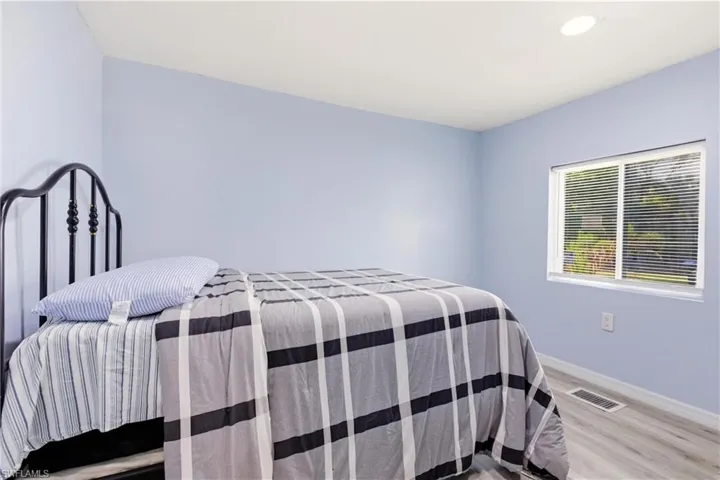 Bedroom featuring light wood finished floors and recessed lighting