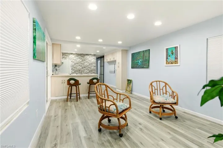 Sitting room featuring light wood-style flooring and recessed lighting