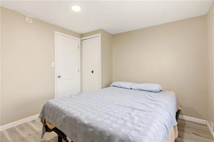Bedroom with light wood-style floors