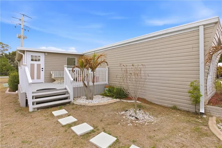 View of home's exterior featuring a deck