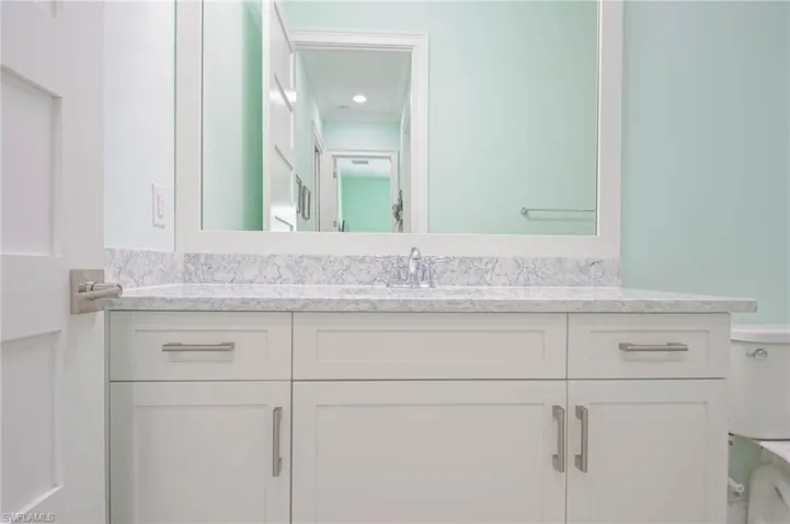 Bathroom featuring vanity and toilet