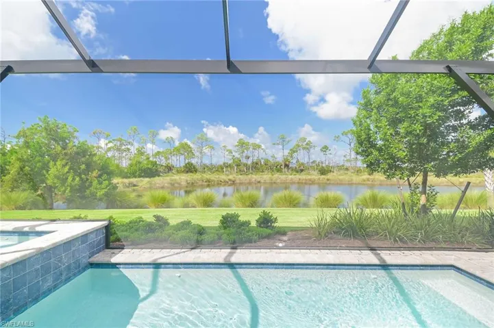 View of swimming pool with a water view