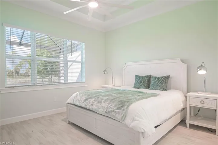 Bedroom featuring light wood-type flooring and ceiling fan
