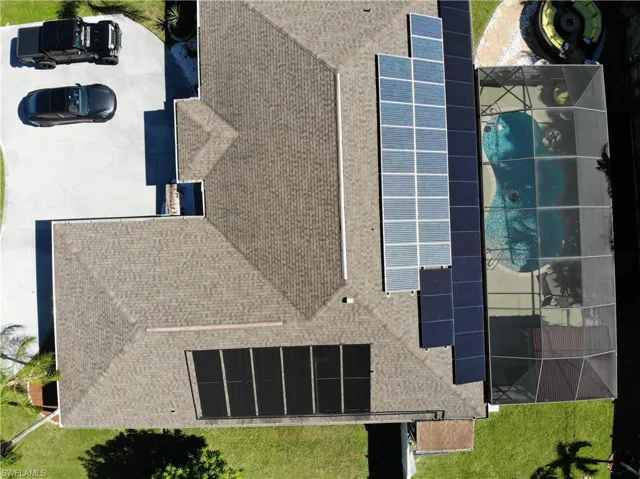 View of subject property featuring a pool