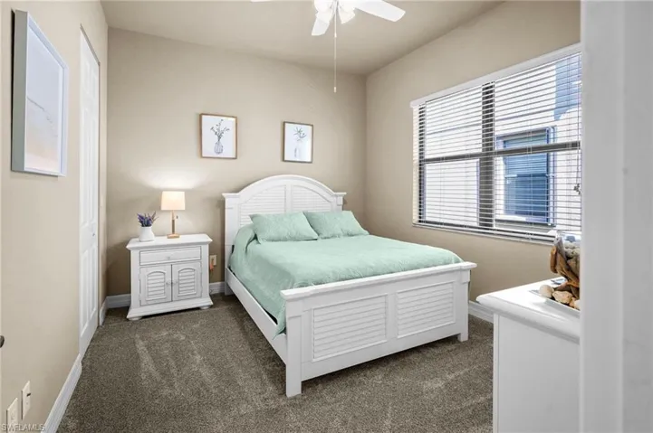 Bedroom with carpet and ceiling fan