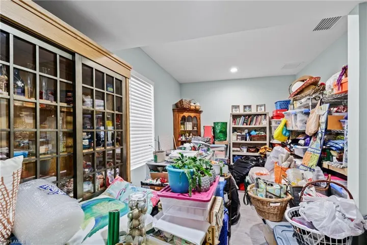 Panty room off the dinette, being used for packing room Look at the glass door pantry! Bonus Room