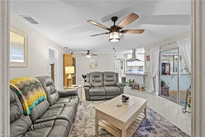 Great room off the kitchen and dining area - open to the pool area