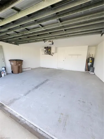 Garage featuring water heater