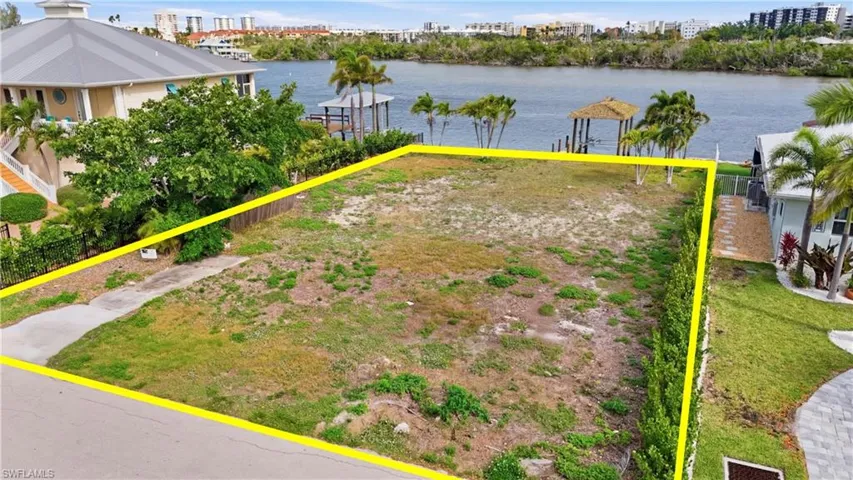 View of yard featuring a water view and a city view - Virtually Edited Image