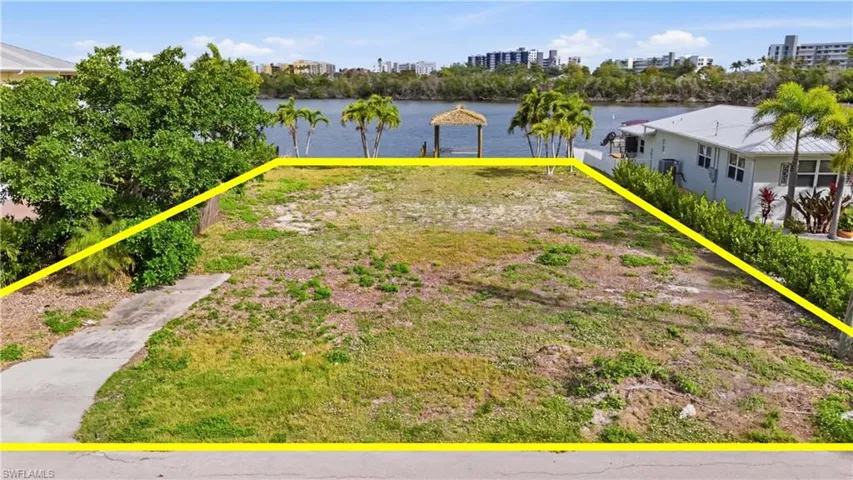 View of yard with a water view - Virtually Edited Image