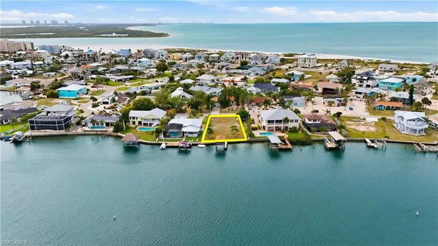 Aerial perspective of suburban area with a large body of water - Virtually Edited Image
