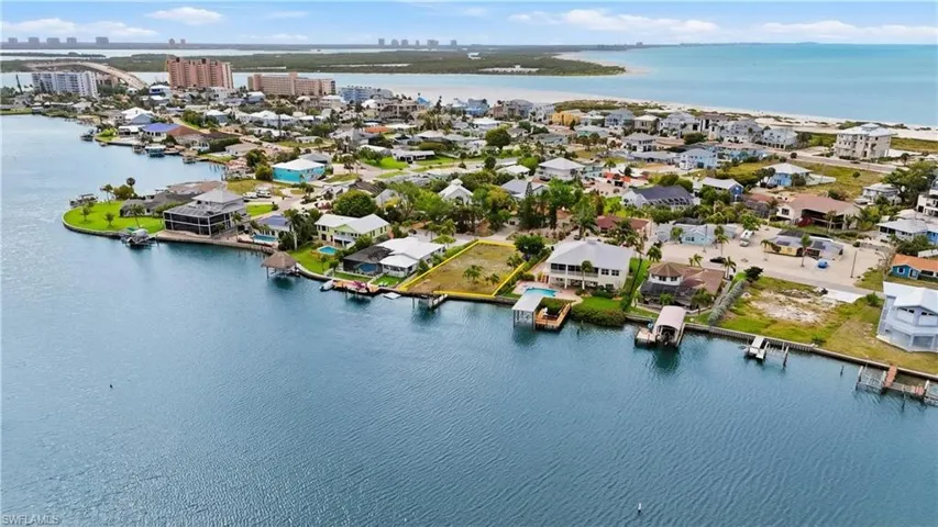 View of urban area with a large body of water and nearby suburban area - Virtually Edited Image