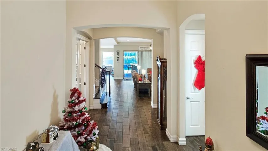 Hallway featuring dark hardwood / wood-style floors