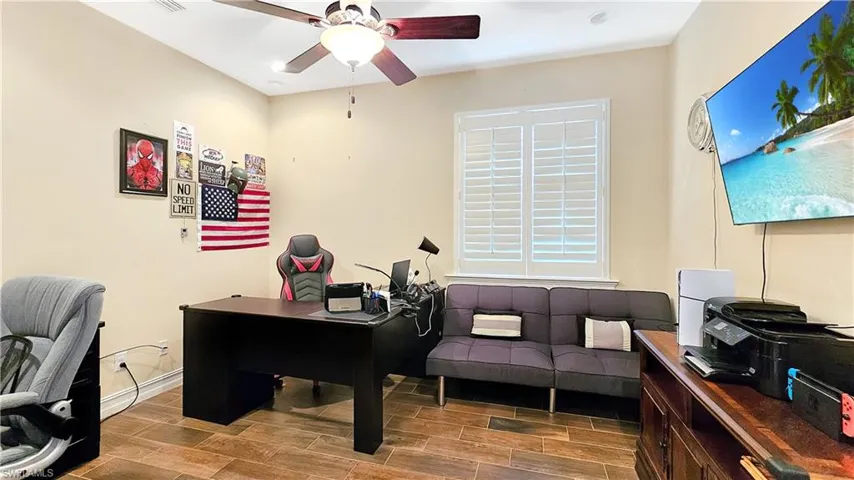 Office space featuring wood-type flooring and ceiling fan