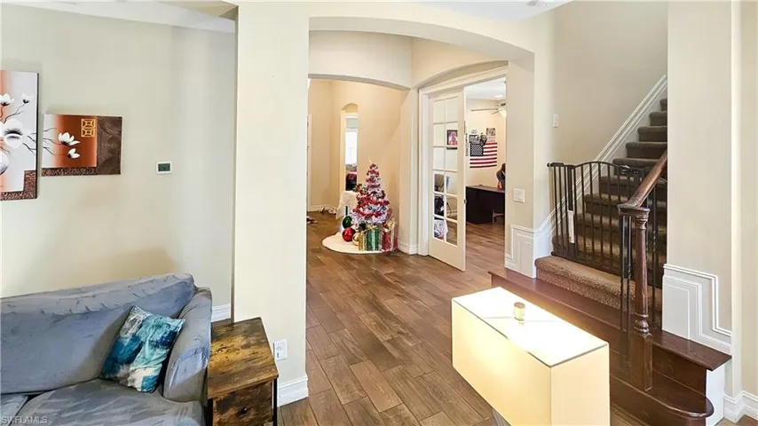 Corridor featuring/ wood-looking ceramic plank flooring