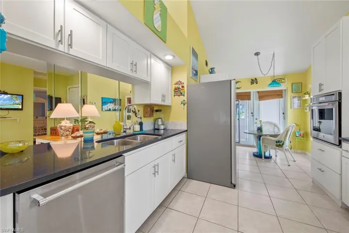 Kitchen with eat-in leading to outdoor courtyard
