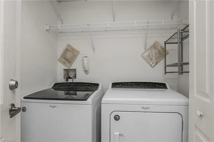 Laundry room featuring washing machine and clothes dryer