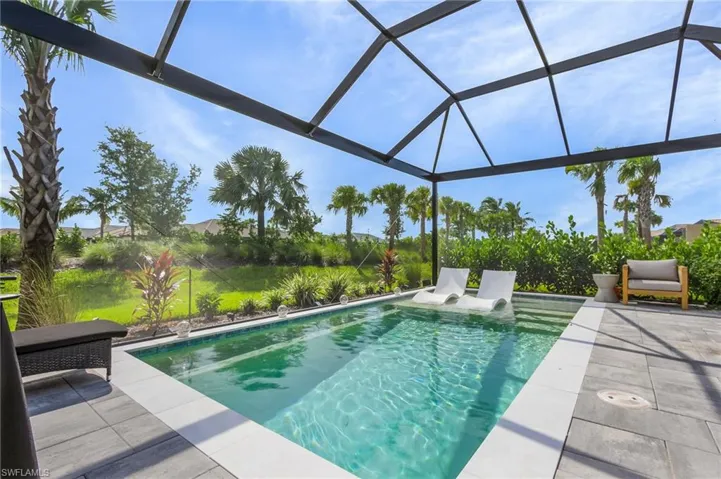 View of pool with a lanai